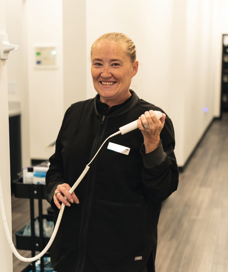 A young woman having a dental exam preformed AT esteem dental studio