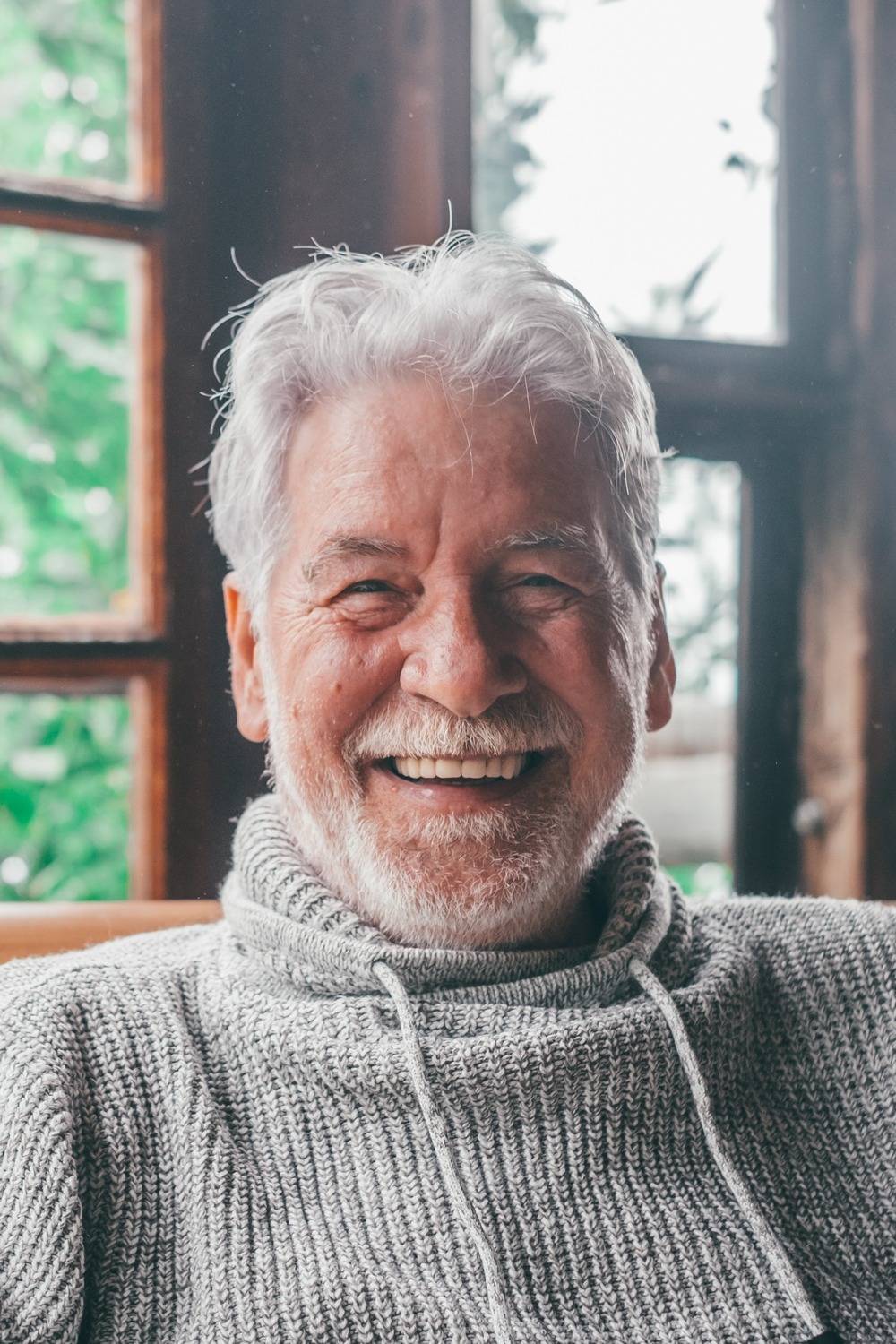 Man showing his restored smile with nitrous oxide in powder springs