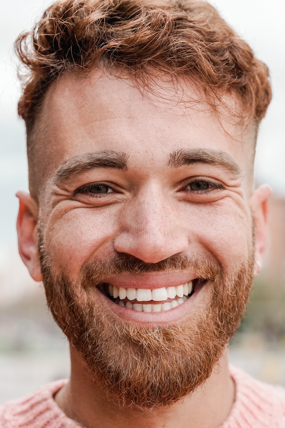 Man smiling after a dental porcedure with sedation