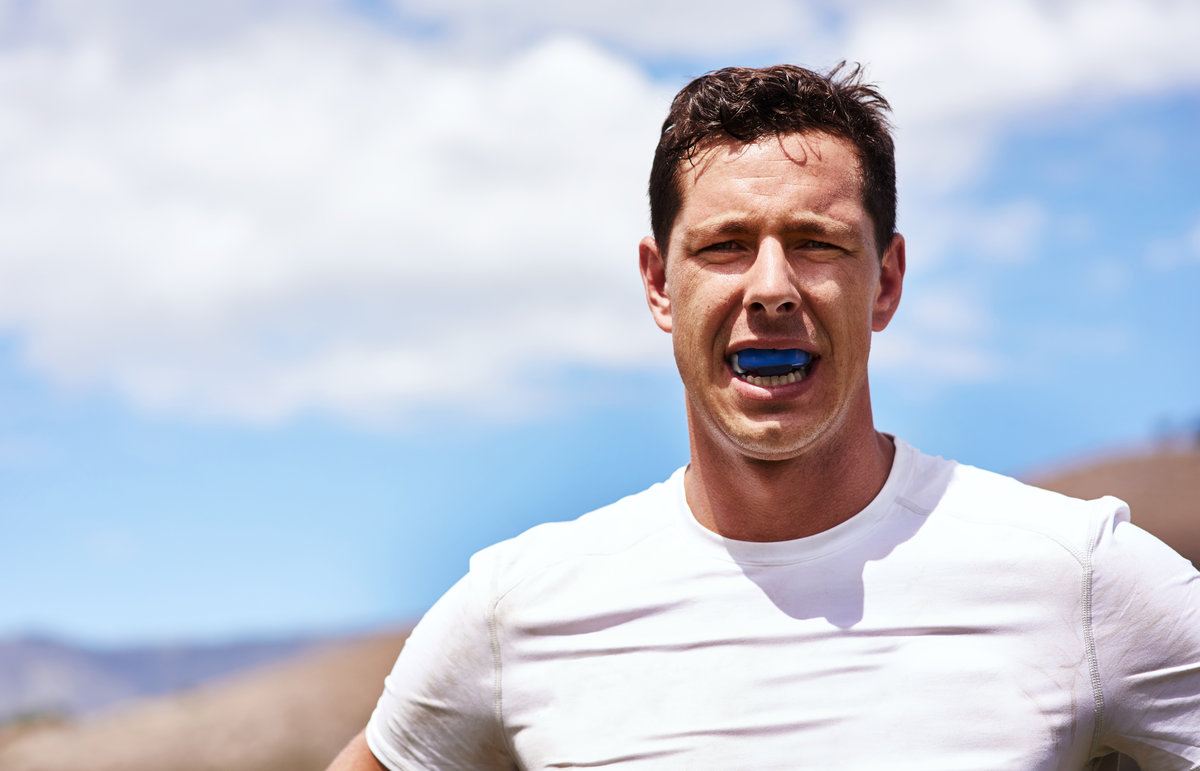 No gum bruises for me. Portrait of a young man wearing a gum guard while playing a game of rugby