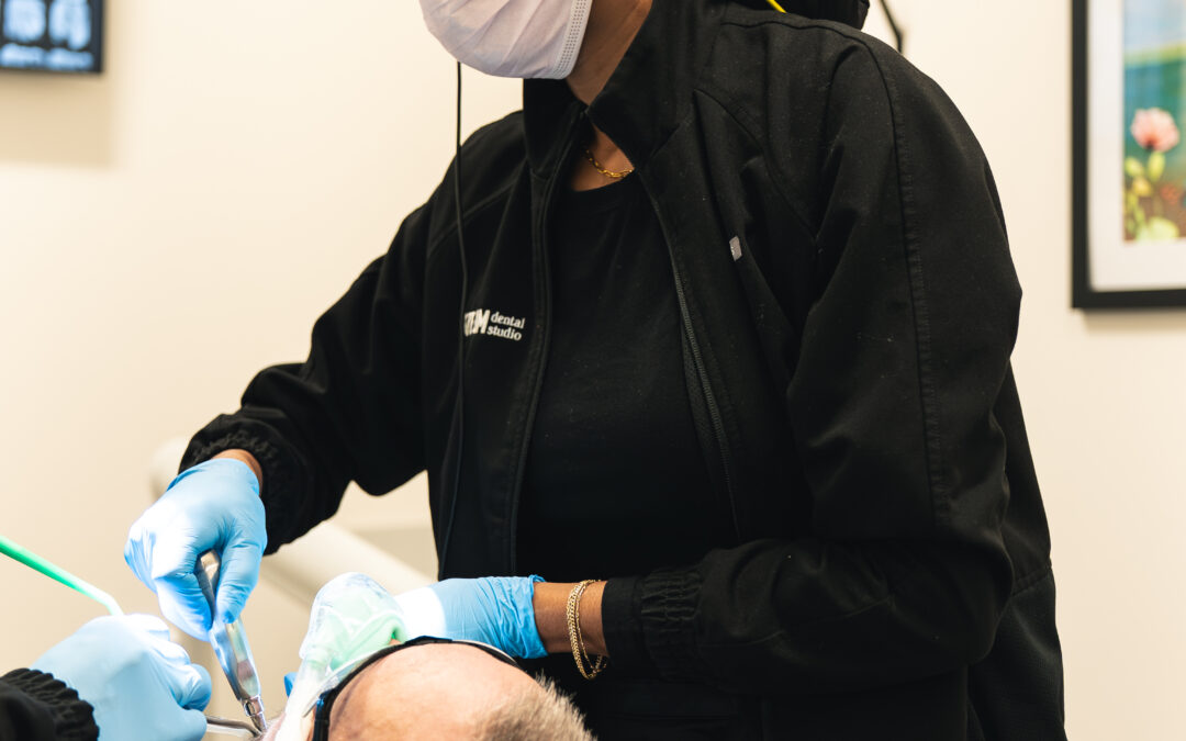 Dental patient relaxed in chair during sedation dentistry visit